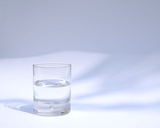 glass of water that is nectar thick consistency with naturally thick thickener