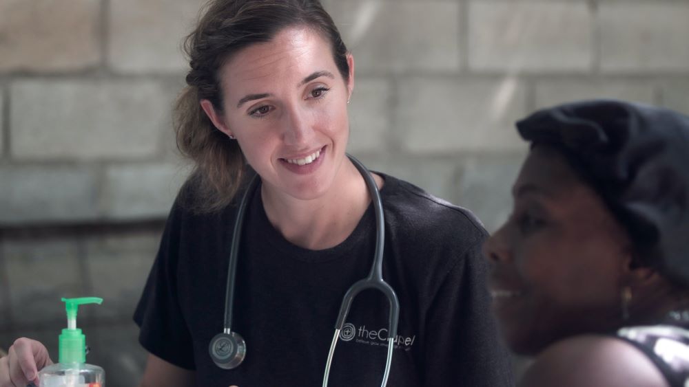 nurse listening to patient talk about dysphagia